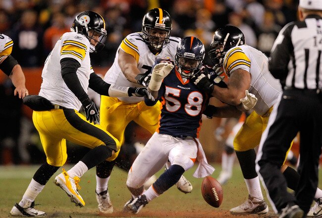 DENVER, CO - JANUARY 08:  Ben Roethlisberger #7 of the Pittsburgh Steelers dives for the ball after losing it against Von Miller #58 of the Denver Broncos during the AFC Wild Card Playoff game at Sports Authority Field at Mile High on January 8, 2012 in Denver, Colorado.  (Photo by Justin Edmonds/Getty Images)