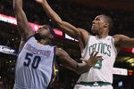BOSTON, MA - MARCH 23:  Zach Randolph #50 of the Memphis Grizzlies takes a shot as Rajon Rondo #9 of the Boston Celtics defends on March 23, 2011 at the TD Garden in Boston, Massachusetts.  NOTE TO USER: User expressly acknowledges and agrees that, by downloading and/or using this Photograph, User is consenting to the terms and conditions of the Getty Images License Agreement.  (Photo by Elsa/Getty Images)