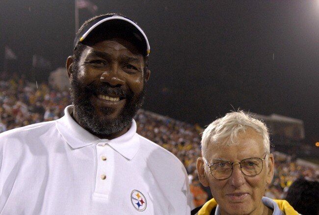 CANTON, OH - AUGUST 5:  Joe Greene and owner Dan Rooney of the Pittsburgh Steelers pose on the field during the AFC-NFC Pro Football Hall of Fame Game against the New Orleans Saints at Fawcett Stadium August 5, 2007 in Canton, Ohio.  (Photo by Al Messerschmidt/Getty Images)