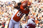 CINCINNATI, OH - DECEMBER 24: Jerome Simpson #89 of the Cincinnati Bengals jumps over Daryl Washington #58 of the Arizona Cardinals for a 19-yard touchdown during first half action at Paul Brown Stadium on December 24, 2011 in Cincinnati, Ohio. (Photo by Joe Robbins/Getty Images)