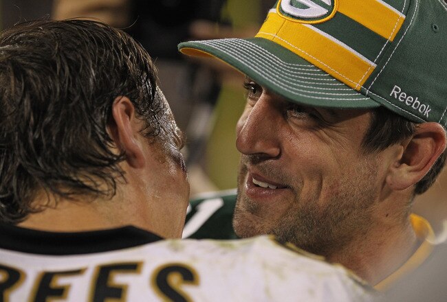 GREEN BAY, WI - SEPTEMBER 08: Aaron Rodgers #12 of the Green Bay Packers talks with Drew Brees #9 of the New Orleans Saints after the NFL opening season game at Lambeau Field on September 8, 2011 in Green Bay, Wisconsin. The Packers defeated the Saints 42-34. (Photo by Jonathan Daniel/Getty Images)