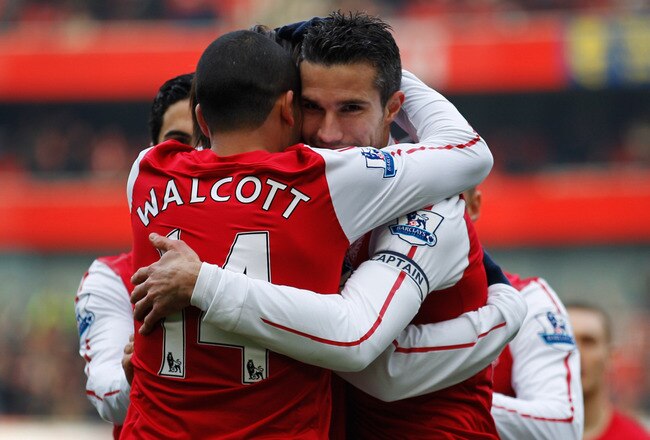 LONDON, ENGLAND - FEBRUARY 04:  Robin van Persie of Arsenal celebrates with teammate Theo Walcott after scoring the first goal during the Barclays Premier League match between Arsenal and Blackburn Rovers at Emirates Stadium on February 4, 2012 in London, England.  (Photo by Paul Gilham/Getty Images)