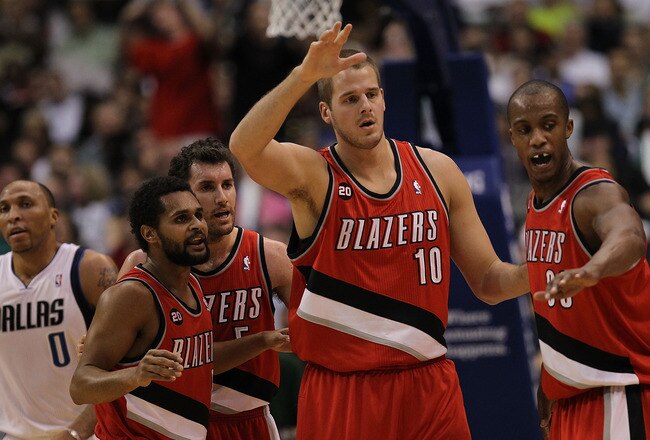 DALLAS, TX - DECEMBER 15:  (L-R) Patrick Mills #8, Rudy Fernandez #4, Joel Przybilla #10 and Dante Cunningham #33 of the Portland Trail Blazers at American Airlines Center on December 15, 2010 in Dallas, Texas.  NOTE TO USER: User expressly acknowledges and agrees that, by downloading and or using this photograph, User is consenting to the terms and conditions of the Getty Images License Agreement.  (Photo by Ronald Martinez/Getty Images)