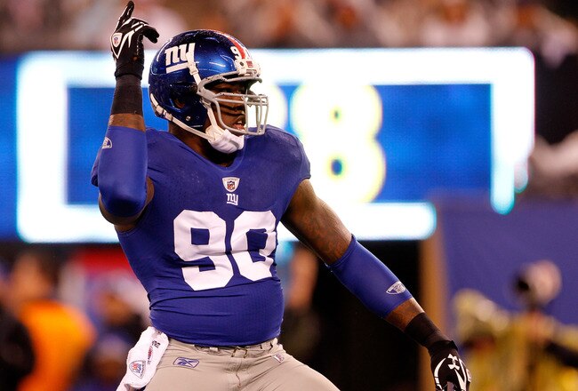 EAST RUTHERFORD, NJ - JANUARY 01:  Jason Pierre-Paul #90 of the New York Giants reacts after a sack in the first quarter against the Dallas Cowboys at MetLife Stadium on January 1, 2012 in East Rutherford, New Jersey.  (Photo by Rich Schultz/Getty Images)