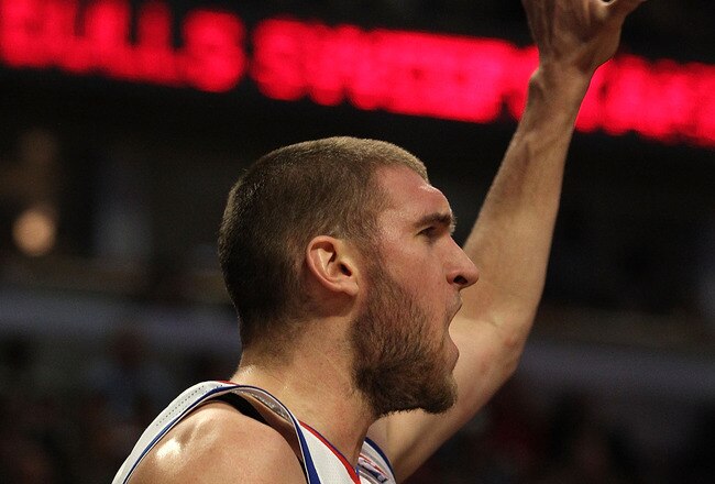 CHICAGO, IL - MARCH 28: Spencer Hawes #00 of the Philadelphia 76ers celebrates a win over the Chicago Bulls at the United Center on March 28, 2011 in Chicago, Illinois. The 76ers defeated the Bulls 97-85. NOTE TO USER: User expressly acknowledges and agrees that, by downloading and/or using this photograph, User is consenting to the terms and conditions of the Getty Images License Agreement. (Photo by Jonathan Daniel/Getty Images)