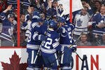 OTTAWA, CANADA - FEBUARY 4: Tyler Bozak #42 of the Toronto Maple Leafs celebrates a first period goal with teammates Joffrey Lupul #19 and Jake Gardiner during an NHL game against the Ottawa Senators at Scotiabank Place on February 4, 2012 in Ottawa, Ontario, Canada.  (Photo by Jana Chytilova/Freestyle Photography/Getty Images)