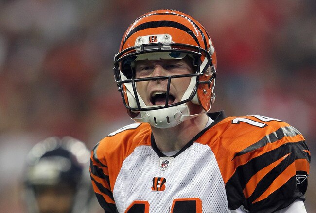 HOUSTON, TX - JANUARY 07:  Andy Dalton #14 of the Cincinnati Bengals reacts against the Houston Texans during their 2012 AFC Wild Card Playoff game at Reliant Stadium on January 7, 2012 in Houston, Texas.  (Photo by Jamie Squire/Getty Images)