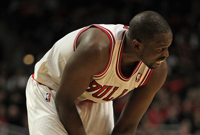CHICAGO, IL - JANUARY 21:  Loul Deng #9 of the Chicago Bulls holds his wrist after injuring it shooting a shot against the Charlotte Bobcats at the United Center on January 21, 2012 in Chicago, Illinois. The Bulls defeated the Bobcats 95-89. NOTE TO USER: User expressly acknowledges and agrees that, by downloading and or using this photograph, User is consenting to the terms and conditions of the Getty Images License Agreement.  (Photo by Jonathan Daniel/Getty Images)