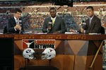 AUSTIN, TX - SEPTEMBER 10: Longhorn Network broadcasters (L - R) Lowell Galindo, Priest Holmes, and Joey Harrington report on the Texas GameDay set before the NCAA game between the Texas Longhorns and the BYU Cougars on September 10, 2011 at Darrell K. Royal-Texas Memorial Stadium in Austin, Texas.  Texas defeated BYU 17-16. (Photo by Erich Schlegel/Getty Images)