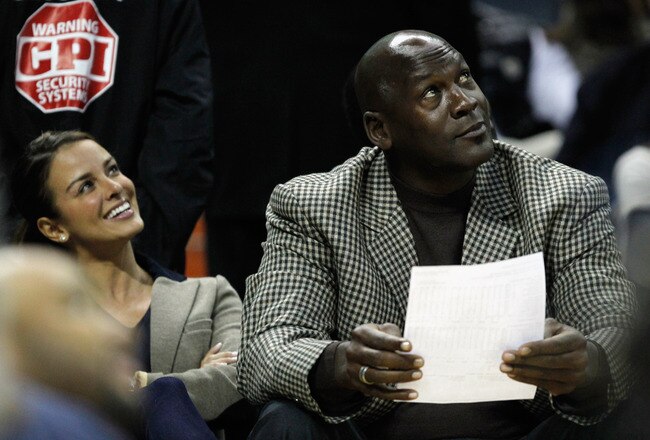 CHARLOTTE, NC - JANUARY 14:  Charlotte Bobcats owner, Michael Jordan sits beside fiance, Yvette Prieto during the Golden State Warriors versus Charlotte Bobcats game at Time Warner Cable Arena on January 14, 2012 in Charlotte, North Carolina.  NOTE TO USER: User expressly acknowledges and agrees that, by downloading and or using this photograph, User is consenting to the terms and conditions of the Getty Images License Agreement.  (Photo by Streeter Lecka/Getty Images)