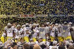 NEW ORLEANS, LA - JANUARY 03:  The Michigan Wolverines celebrate as confetti falls after they won 23-20 against the Virginia Tech Hokies during the Allstate Sugar Bowl at Mercedes-Benz Superdome on January 3, 2012 in New Orleans, Louisiana.  (Photo by Matthew Stockman/Getty Images)