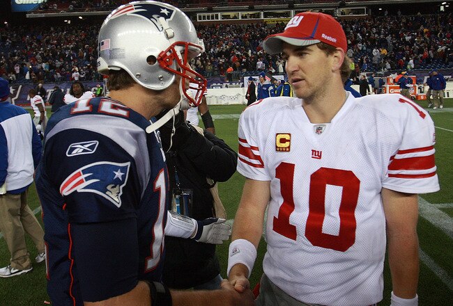 FOXBORO, MA - NOVEMBER 6:    Tom Brady #12 of the New England Patriots congratulates  Eli Manning #10 of the New York Giants after the New York Giants 24-20 win on November 6, 2011 in Foxboro, Massachusetts. (Photo by Jim Rogash/Getty Images)