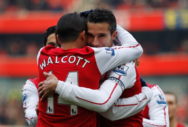 LONDON, ENGLAND - FEBRUARY 04:  Robin van Persie of Arsenal celebrates with teammate Theo Walcott after scoring the first goal during the Barclays Premier League match between Arsenal and Blackburn Rovers at Emirates Stadium on February 4, 2012 in London, England.  (Photo by Paul Gilham/Getty Images)