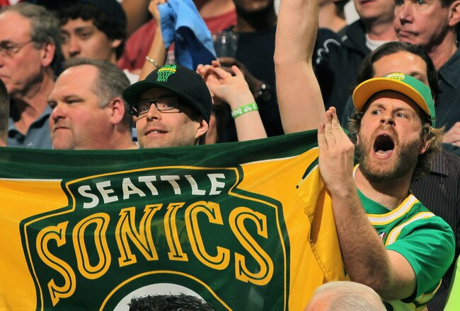 DENVER, CO - APRIL 23:  Seattle Sonics fans display signs as the support the Denver Nuggets against the Oklahoma City Thunder in Game Three of the Western Conference Quarterfinals in the 2011 NBA Playoffs on April 23, 2011 at the Pepsi Center in Denver, Colorado. NOTE TO USER: User expressly acknowledges and agrees that, by downloading and or using this photograph, User is consenting to the terms and conditions of the Getty Images License Agreement.  (Photo by Doug Pensinger/Getty Images)