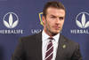 LOS ANGELES, CA - JANUARY 19:  Midfielder David Beckham gets ready in his seat for the press conference announcing his new contract with the Los Angeles Galaxy at Staples Center on January 19, 2012 in Los Angeles, California.  (Photo by Victor Decolongon/Getty Images)