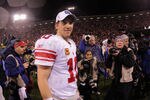 SAN FRANCISCO, CA - JANUARY 22:  Eli Manning #10 of the New York Giants walks off of the field after the Giants won 20-17 in overtime against the San Francisco 49ers during the NFC Championship Game at Candlestick Park on January 22, 2012 in San Francisco, California.  (Photo by Doug Pensinger/Getty Images)