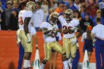 GAINESVILLE, FL - NOVEMBER 26:  Cornerback Greg Reid #5 of the Florida State Seminoles celebrates a first quarter interception against the Florida Gators November 26, 2011 at Ben Hill Griffin Stadium in Gainesville, Florida.  (Photo by Al Messerschmidt/Getty Images)