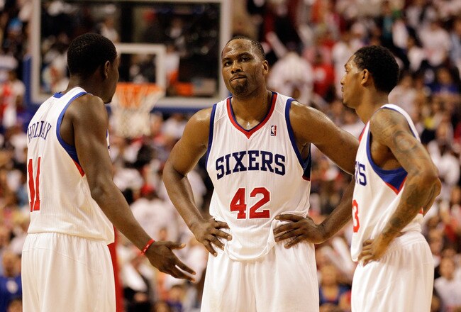PHILADELPHIA, PA - APRIL 21: Elton Brand #42 of the Philadelphia 76ers talks with teammates Jrue Holiday #11 (L) and Lou Williams #23 (R)  during the closing moments of their game against the Miami Heat during game three of the Eastern Conference Quarterfinals at Wells Fargo Center on April 21, 2011 in Philadelphia, Pennsylvania.NOTE TO USER: User expressly acknowledges and agrees that, by downloading and/or using this Photograph, User is consenting to the terms and conditions of the Getty Images License Agreement.  (Photo by Rob Carr/Getty Images)