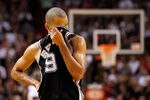 MIAMI, FL - JANUARY 17:  Tony Parker #9 of the San Antonio Spurs wipes his face during a game against the Miami Heat at American Airlines Arena on January 17, 2012 in Miami, Florida. NOTE TO USER: User expressly acknowledges and agrees that, by downloading and/or using this Photograph, User is consenting to the terms and conditions of the Getty Images License Agreement.  (Photo by Mike Ehrmann/Getty Images)