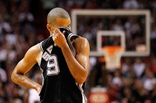 MIAMI, FL - JANUARY 17:  Tony Parker #9 of the San Antonio Spurs wipes his face during a game against the Miami Heat at American Airlines Arena on January 17, 2012 in Miami, Florida. NOTE TO USER: User expressly acknowledges and agrees that, by downloading and/or using this Photograph, User is consenting to the terms and conditions of the Getty Images License Agreement.  (Photo by Mike Ehrmann/Getty Images)
