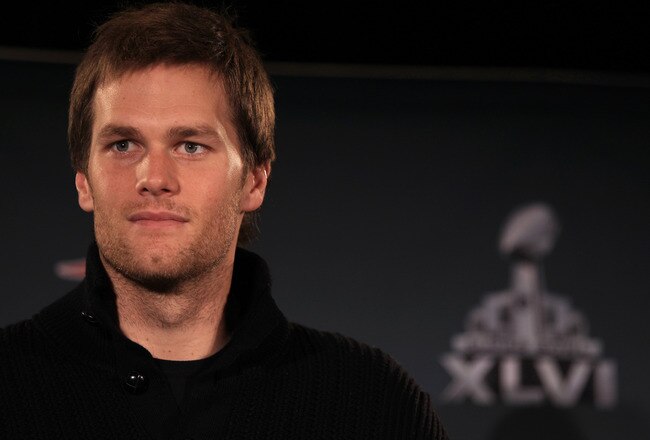 INDIANAPOLIS, IN - FEBRUARY 01:  Tom Brady #12 of the New England Patriots answers questions from the press during a media availability session for Super Bowl XLVI at the University Place Conference Center & Hotel on February 1, 2012 in Indianapolis, Indiana.  (Photo by Scott Halleran/Getty Images)