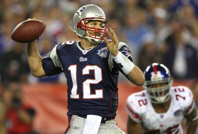 GLENDALE, AZ - FEBRUARY 03:  Quarterback Tom Brady #12 of the New England Patriots drops back to pass against the New York Giants the second half of Super Bowl XLII on February 3, 2008 at the University of Phoenix Stadium in Glendale, Arizona. The Giants defeated the Patriots 17-14.  (Photo by Donald Miralle/Getty Images)