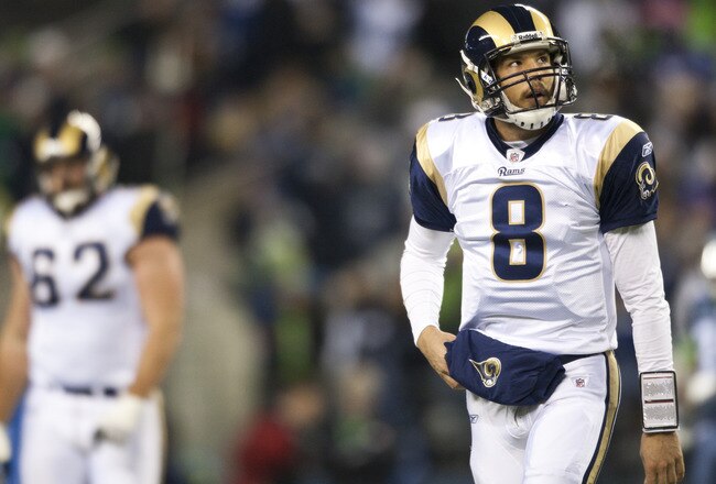 SEATTLE, WA - DECEMBER 12:  Sam Bradford #8 of the St. Louis Rams leaves the field after an unsuccessful attempt for a first down against the Seattle Seahawks at CenturyLink Field December 12, 2011 in Seattle, Washington. Seattle won 33-13. (Photo by Jay Drowns/Getty Images)