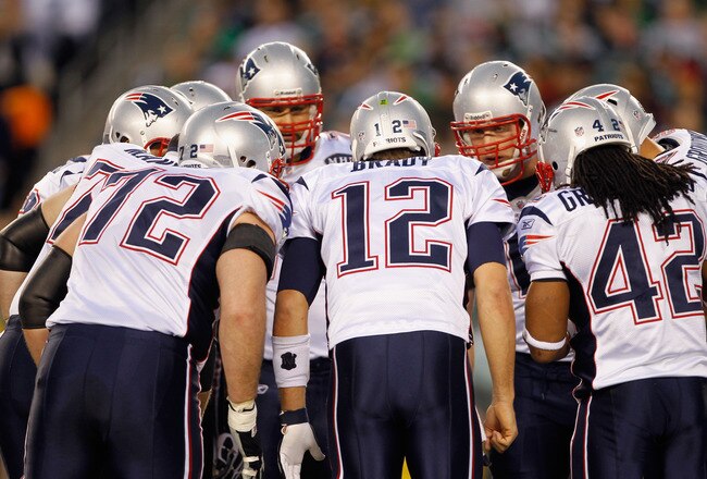 PHILADELPHIA, PA - NOVEMBER 27:  Tom Brady #12 of the New England Patriots huddles up with his teammates on offense against the Philadelphia Eagles at Lincoln Financial Field on November 27, 2011 in Philadelphia, Pennsylvania. The Patriots won 38-20. (Photo by Rich Schultz/Getty Images)
