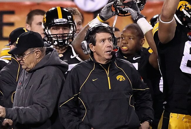 TEMPE, AZ - DECEMBER 28:  Head coach Kirk Ferentz (C) of the Iowa Hawkeyes celebrates with teammates after defeating the Missouri Tigers in the Insight Bowl at Sun Devil Stadium on December 28, 2010 in Tempe, Arizona.  The Hawkeyes defeated the Tigers 27-24.  (Photo by Christian Petersen/Getty Images)