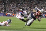 FOXBORO, MA - NOVEMBER 6:   Aaron Hernandez #81 of the New England Patriots scores against the defense of  Kenny Phillips #21 of the New York Giants at Gillette Stadium in the second half on November 6, 2011 in Foxboro, Massachusetts. (Photo by Jim Rogash/Getty Images)