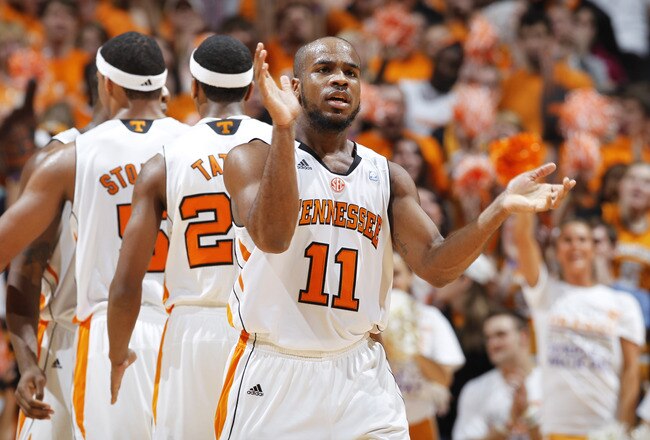 KNOXVILLE, TN - JANUARY 21: Trae Golden #11 of the Tennessee Volunteers celebrates late in the game against the Connecticut Huskies at Thompson-Boling Arena on January 21, 2012 in Knoxville, Tennessee. Tennessee defeated Connecticut 60-57. (Photo by Joe Robbins/Getty Images)
