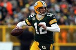 GREEN BAY, WI - JANUARY 15:  Aaron Rodgers #12 of the Green Bay Packers looks to pass against the New York Giants during their NFC Divisional playoff game at Lambeau Field on January 15, 2012 in Green Bay, Wisconsin.  (Photo by Jonathan Daniel/Getty Images)