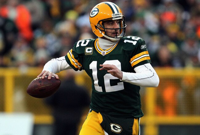 GREEN BAY, WI - JANUARY 15:  Aaron Rodgers #12 of the Green Bay Packers looks to pass against the New York Giants during their NFC Divisional playoff game at Lambeau Field on January 15, 2012 in Green Bay, Wisconsin.  (Photo by Jonathan Daniel/Getty Images)