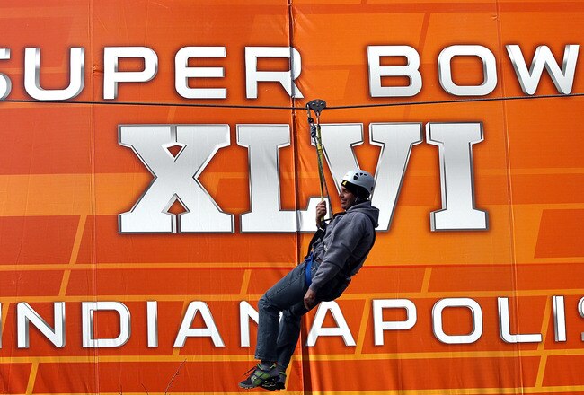 INDIANAPOLIS, IN - FEBRUARY 03:  Fans ride zip lines while they attend the Super Bowl XLVI NFL Experience presented by GMC at the Indiana Convention Center on February 3, 2012 in Indianapolis, Indiana. The New England Patriots will play the New York Giants in Super Bowl XLVI on February 5, 2011 at Lucas Oil Stadium in Indianapolis, Indiana.  (Photo by Win McNamee/Getty Images)