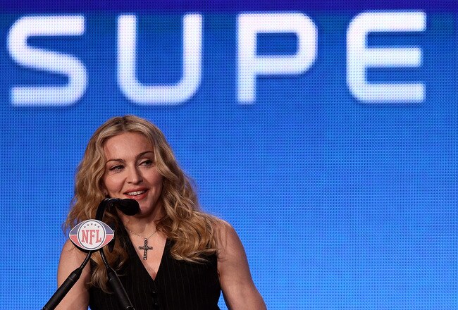 INDIANAPOLIS, IN - FEBRUARY 02:  Singer Madonna appears during a press conference for the Bridgestone Super Bowl XLVI halftime show at the Super Bowl XLVI Media Center in the J.W. Marriott Indianapolis on February 2, 2012 in Indianapolis, Indiana.  (Photo by Win McNamee/Getty Images)