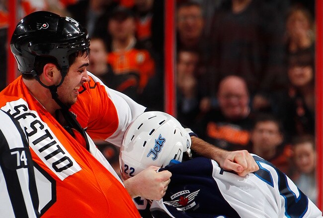 PHILADELPHIA, PA - JANUARY 31:  Chris Thorburn #22 of the Winnipeg Jets fights with Tom Sestito #32 of the Philadelphia Flyers during the third period of an NHL hockey game at Wells Fargo Center on January 31, 2012 in Philadelphia, Pennsylvania.  (Photo by Paul Bereswill/Getty Images)