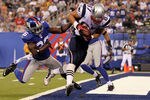 EAST RUTHERFORD, NJ - SEPTEMBER 02:  Rob Gronkowski #87 of the New England Patriots carries a reception into the endzone past Antrel Rolle #26 of the New York Giants for a first quarter touchdown on September 2, 2010 at the New Meadowlands Stadium in East Rutherford, New Jersey.  (Photo by Jim McIsaac/Getty Images)