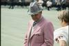 Coach Bear Bryant of the Alabama Crimson Tide watches his players during a game.
