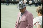 Coach Bear Bryant of the Alabama Crimson Tide watches his players during a game.