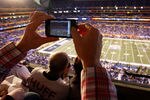 INDIANAPOLIS, IN - FEBRUARY 05:  A fan takes a picture of the field prior to Super Bowl XLVI between the New York Giants and the New England Patriots at Lucas Oil Stadium on February 5, 2012 in Indianapolis, Indiana.  (Photo by Joe Robbins/Getty Images)