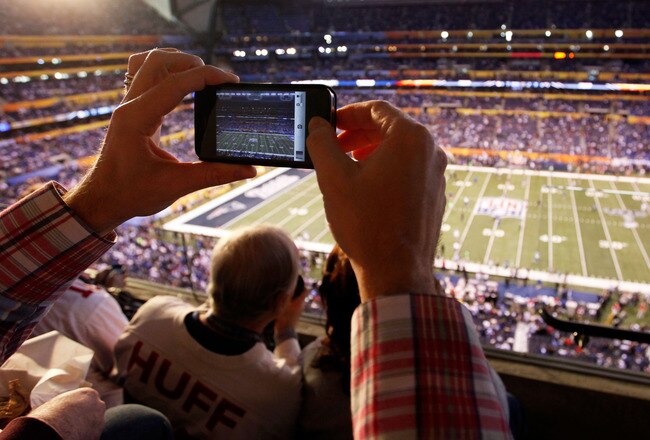 INDIANAPOLIS, IN - FEBRUARY 05:  A fan takes a picture of the field prior to Super Bowl XLVI between the New York Giants and the New England Patriots at Lucas Oil Stadium on February 5, 2012 in Indianapolis, Indiana.  (Photo by Joe Robbins/Getty Images)