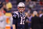 INDIANAPOLIS, IN - FEBRUARY 05:  Tom Brady #12 of the New England Patriots walks across the field before the New England Patriots take on the New York Giants in Super Bowl XLVI at Lucas Oil Stadium on February 5, 2012 in Indianapolis, Indiana.  (Photo by Elsa/Getty Images)