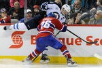 MONTREAL, CANADA - FEBRUARY 5:  Josh Gorges #26 of the Montreal Canadiens body checks Andrew Ladd #16 of the Winnipeg Jets during the NHL game at the Bell Centre on February 5, 2012 in Montreal, Quebec, Canada.  The Canadiens defeated the Jets 3-0.  (Photo by Richard Wolowicz/Getty Images)