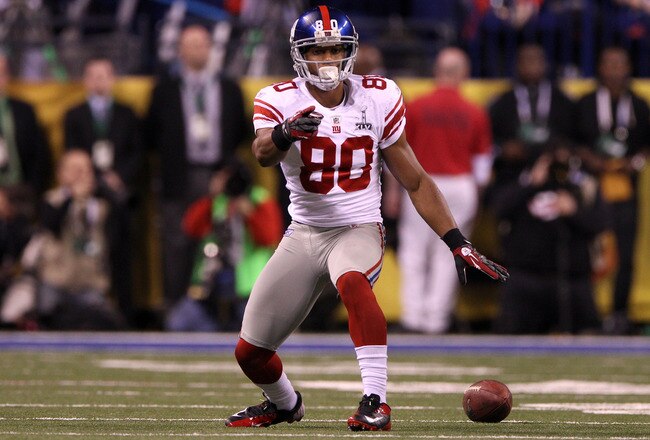 INDIANAPOLIS, IN - FEBRUARY 05:  Victor Cruz #80 of the New York Giants reacts to a first down during the first quarter against the New England Patriots during Super Bowl XLVI at Lucas Oil Stadium on February 5, 2012 in Indianapolis, Indiana.  (Photo by Elsa/Getty Images)
