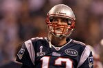 INDIANAPOLIS, IN - FEBRUARY 05:  Quarterback Tom Brady #12 of the New England Patriots stands on the field prior to Super Bowl XLVI against the New York Giants at Lucas Oil Stadium on February 5, 2012 in Indianapolis, Indiana.  (Photo by Jamie Squire/Getty Images)