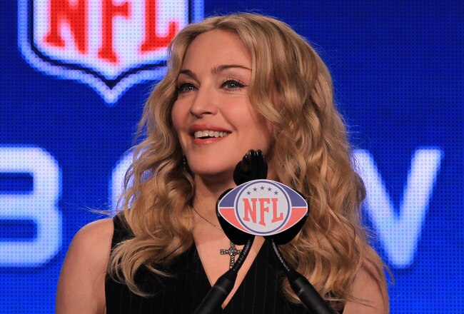 INDIANAPOLIS, IN - FEBRUARY 02:  Singer Madonna speaks at the podium during a press conference for the Bridgestone Super Bowl XLVI halftime show at the Super Bowl XLVI Media Center in the J.W. Marriott Indianapolis on February 2, 2012 in Indianapolis, Indiana.  (Photo by Scott Halleran/Getty Images)