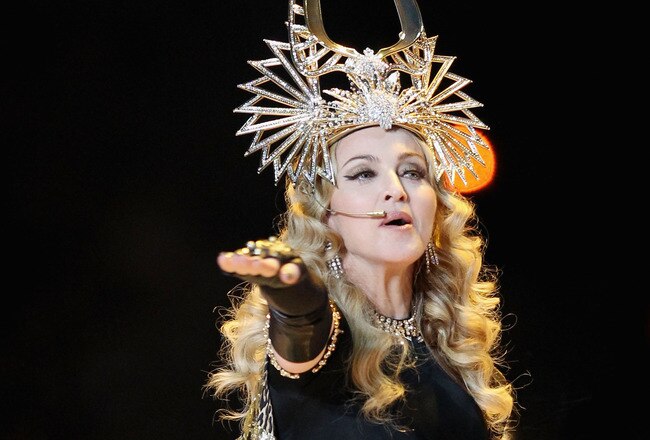 INDIANAPOLIS, IN - FEBRUARY 05:  Singer Madonna performs during the Bridgestone Super Bowl XLVI Halftime Show at Lucas Oil Stadium on February 5, 2012 in Indianapolis, Indiana.  (Photo by Ezra Shaw/Getty Images)