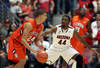 TUCSON, AZ - DECEMBER 10:  Milton Jennings #24 of the Clemson Tigers drives the ball against Solomon Hill #44 of the Arizona Wildcats during the college basketball game at McKale Center on December 10, 2011 in Tucson, Arizona. The Wildcats defeated the Tigers 63-47. (Photo by Christian Petersen/Getty Images)