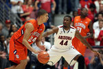 TUCSON, AZ - DECEMBER 10:  Milton Jennings #24 of the Clemson Tigers drives the ball against Solomon Hill #44 of the Arizona Wildcats during the college basketball game at McKale Center on December 10, 2011 in Tucson, Arizona. The Wildcats defeated the Tigers 63-47. (Photo by Christian Petersen/Getty Images)