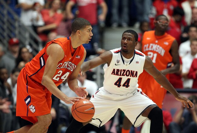 TUCSON, AZ - DECEMBER 10:  Milton Jennings #24 of the Clemson Tigers drives the ball against Solomon Hill #44 of the Arizona Wildcats during the college basketball game at McKale Center on December 10, 2011 in Tucson, Arizona. The Wildcats defeated the Tigers 63-47. (Photo by Christian Petersen/Getty Images)